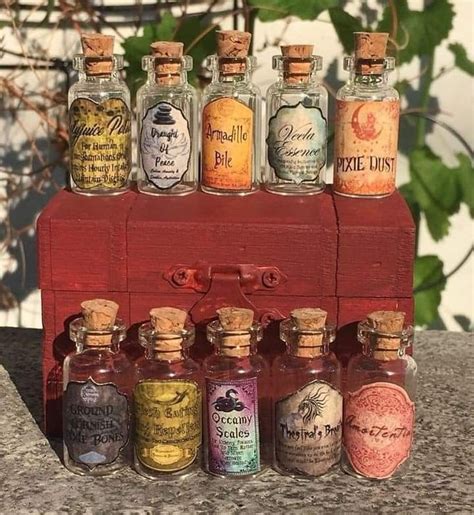 An Assortment Of Miniature Bottles Sitting On Top Of A Wooden Box