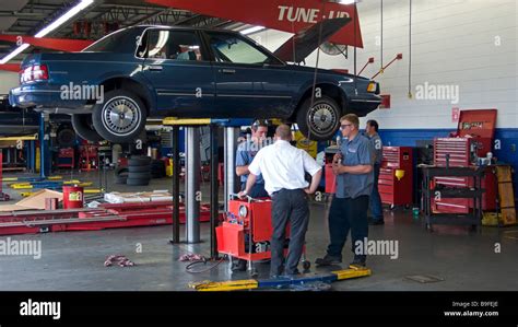 Motor Car On Hydraulic Lift Repair Workshop Springfield Missouri USA