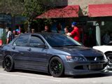 Modified Red Mitsubishi Lancer Evolution Benlevy