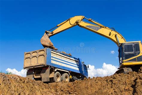 Digger Loading Trucks With Soil Stock Image Image Of Site Equipment