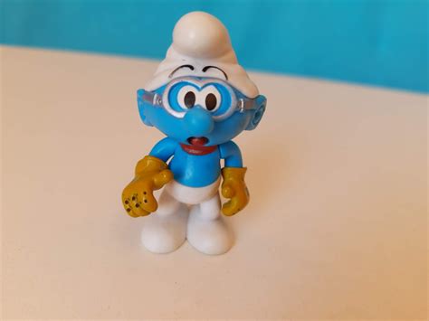 Mini Boneco Articulado Na Cabe A E Bra Os De Smurf Piloto De Culos E