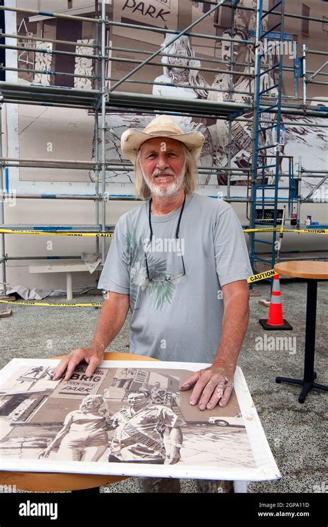 Mural artist Art Mortimer working on the restoration of his mural at ...