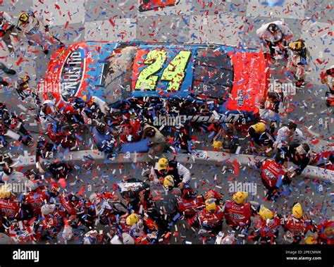 NASCAR driver Jeff Gordon and his crew celebrate in Victory Lane ...