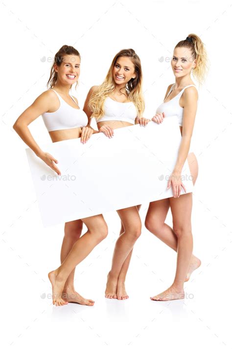 Group Of Happy Friends Posing In Underwear With Banner Stock Photo By