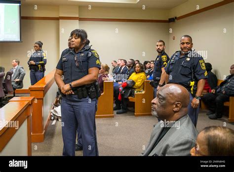 Dekalb County Sheriffs Officers Stand In The Aisle After The Sentencing