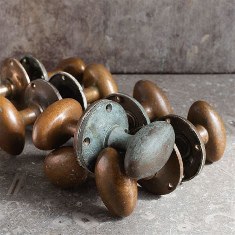 Early Twentieth Century Patinated Brass Oval Door Knobs Lassco