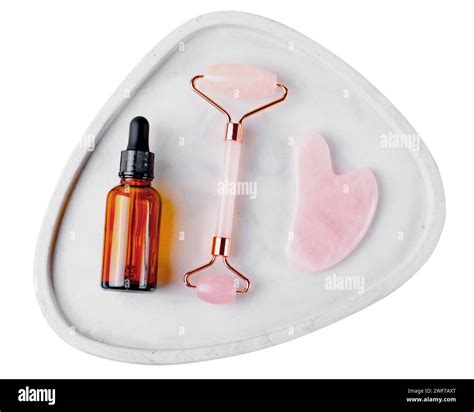 Rose Quartz Roller And Gua Sha Tool Facial Lifting Scraping Massage Treatment On White Isolated