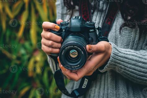 AI Generated Female Hands Holding A Camera 37140174 Stock Photo At Vecteezy