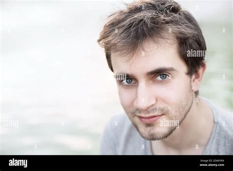 soft focus portrait   young man  blue eyes   light blurred