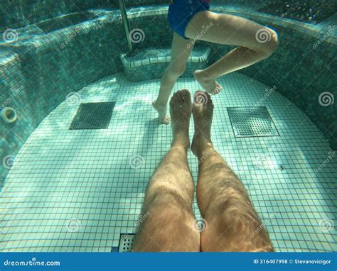 Hot Tub Pool Underwater Shot Of Father And Son Legs In Water Stock Photo Image Of Play Pool