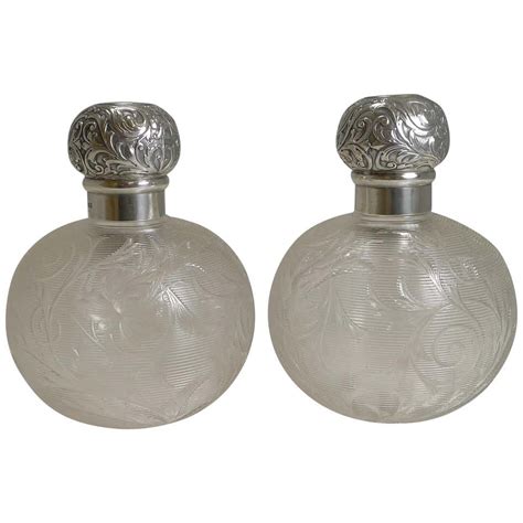 Finest Pair Of Antique English Sterling Topped Perfume Bottles By