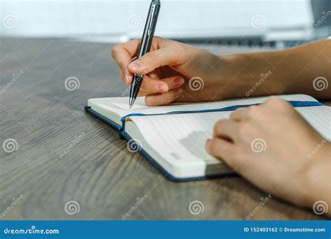 Female Hands Are Writing In A Notebook Stock Photo Image Of Office