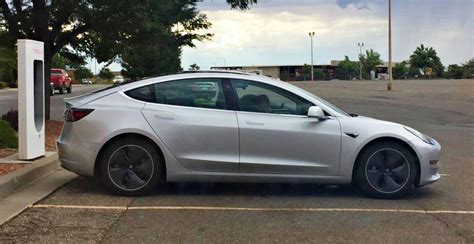 Silver Tesla Model 3 Side Supercharger Teslarati