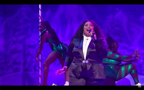 Lizzo Brought Candy Cane Stripper Poles To Snl