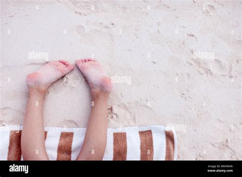 Close Up Of A Little Girl Resting On A Beach Towel Stock Photo Alamy