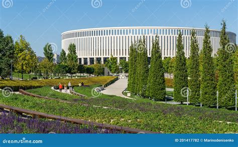 Semicircular Terraces With Sage Go Down To Rows Of Trimmed Thuja