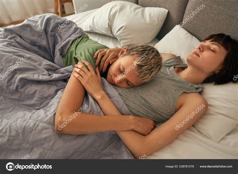 Attractive Lesbian Girls Sleeping On Bed At Home Stock Photo By LanaStock