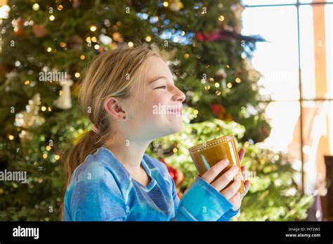 Caucasian Girl Drinking Hot Cocoa At Christmas Stock Photo Alamy