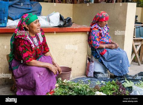 Two Older Indigenous Zapotec Women In Traditional Dress In The Market