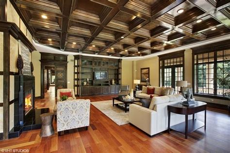 A Large Living Room With Wood Floors And Ceiling