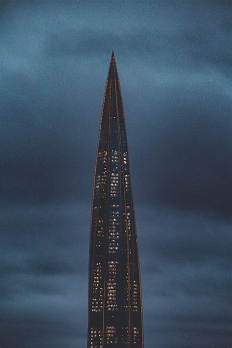 Illuminated Skyscraper on Night Sky Background · Free Stock Photo 