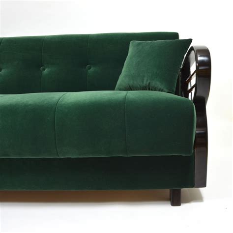 Dark green velvet sofa