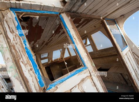 Old Rotting Wooden Boat Abandoned In A Scrap Yard Stock Photo Alamy