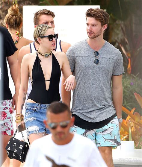 Miley Cyrus at a pool in Miami With Her Boyfriend - December 2014 ...