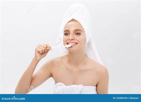 Beauty Portrait Of A Happy Beautiful Half Naked Woman Brushing Her Teeth With A Toothbrush And
