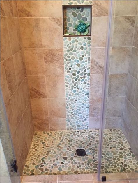 Stunning Shower Remodel Using Sea Green And White Pebble Tile As