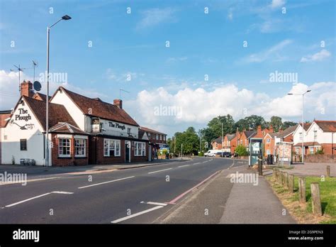 A View Along School Road In Tilehurst Reading Uk With The Plough Pub