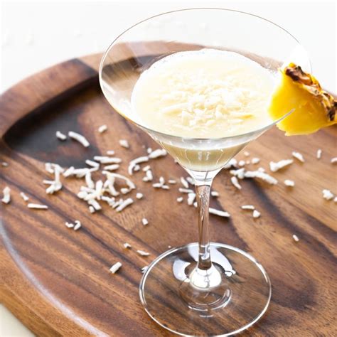 A Drink In A Wine Glass On A Wooden Tray