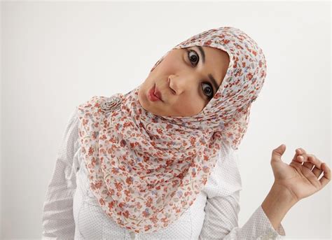 Premium Photo Portrait Of Shocked Woman In Hijab Making Face Against