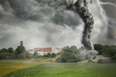 Black tornado funnel and lightning over field during thunderstor Stock Photo by ©vchalup2 93511568