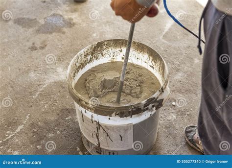 The Solution In The Bucket Is Mixed Using A Construction Mixer Mixing