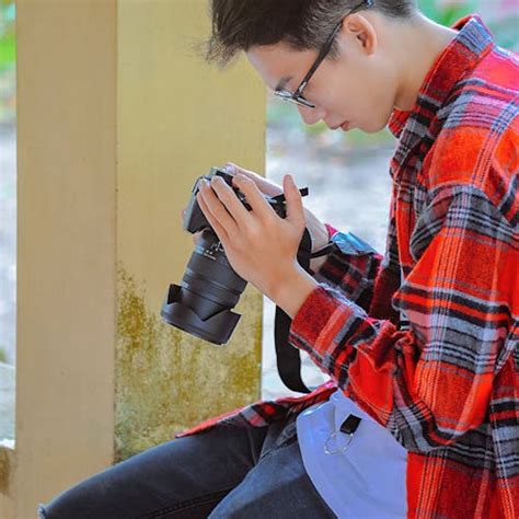 Close-Up Photo of Man Holding Vintage Camera · Free Stock Photo