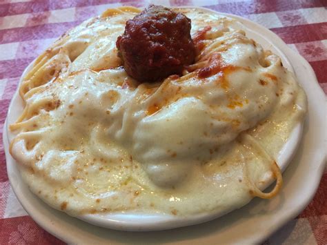 The Story Behind Spaghetti Parmesan Buffalos Outrageously Cheesy Pasta Dish