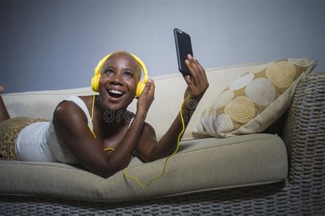 Young Happy And Beautiful Relaxed Black Afro American Woman Listening