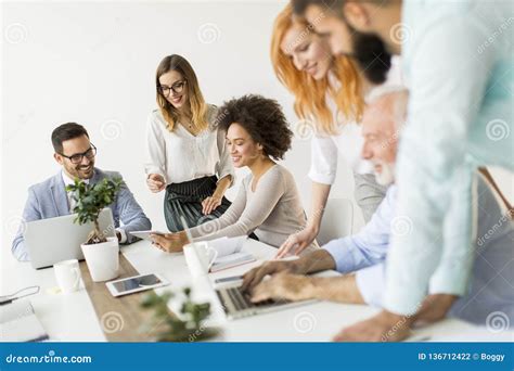 Joyful Multiracial Business Team At Work In Modern Office Stock Photo