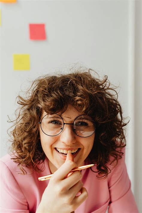 Woman Holding A Pen · Free Stock Photo