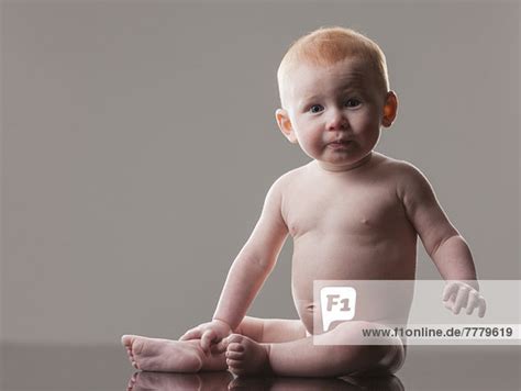 Studio Shot Of Naked Baby Boy Months Sitting