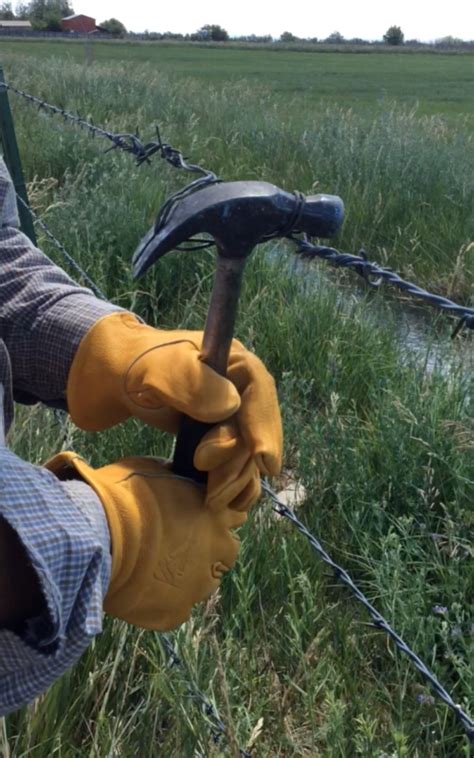 Splicing And Stretching Barbed Wire With A Hammer And Pliers