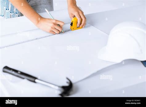 architect drawing on blueprint Stock Photo - Alamy