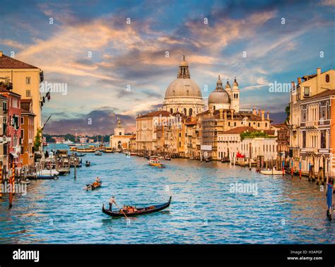 Classic View Of Traditional Gondola On Famous Canal Grande With