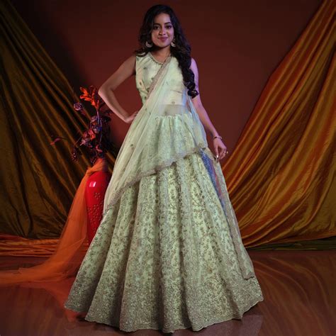 Pista Green Embroidered Netted Lehenga Choli