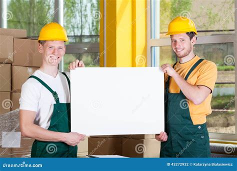 Warehouse Workers Holding A Blank White Board Stock Photo Image Of