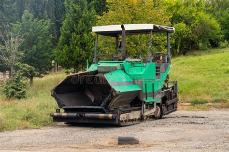 Asphalt Paver Machine. Asphalt Finisher or Paving Machine Placing a ...