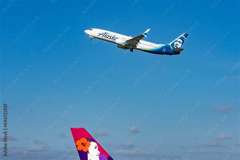 Alaska Airlines Boeing 737 Taking Off Over Hawaiian Airlines Airbus