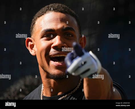 Seattle Mariners Center Fielder Julio Rodriguez Smiles And Points