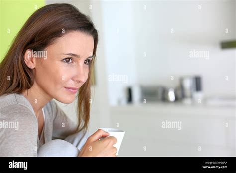 Beautiful Brunette Girl Drinking Coffee Stock Photo Alamy